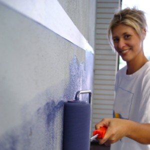homeowner painting condo walls