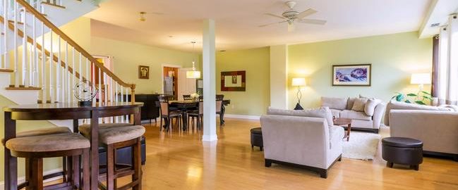 spacious living room in Port Liberte townhome for rent